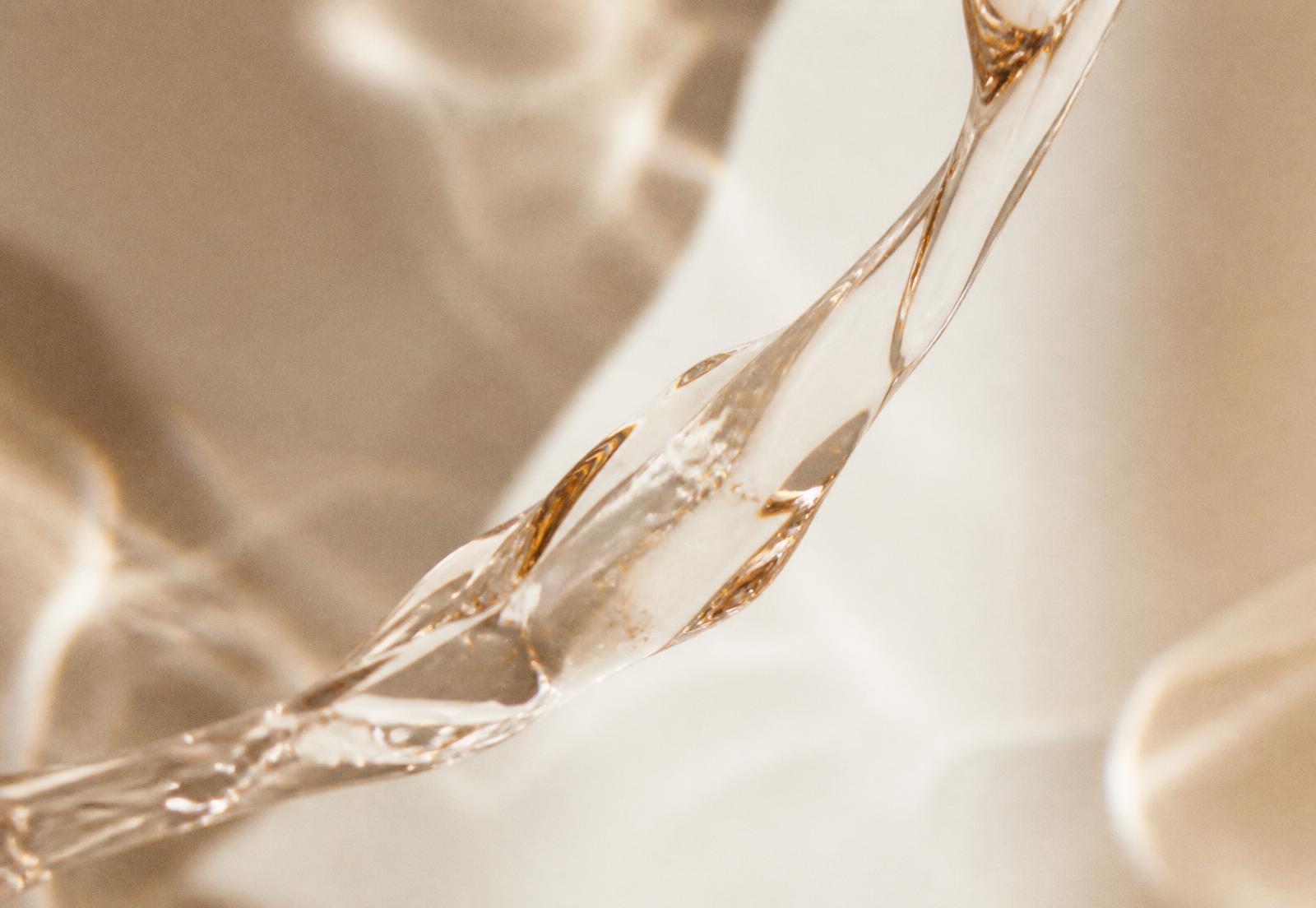 Abstract macro study of a translucent gel ribbon in warm light
